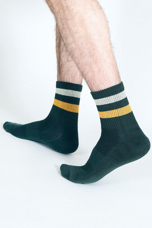 Close up shot of Tailored Union green and yellow tube socks