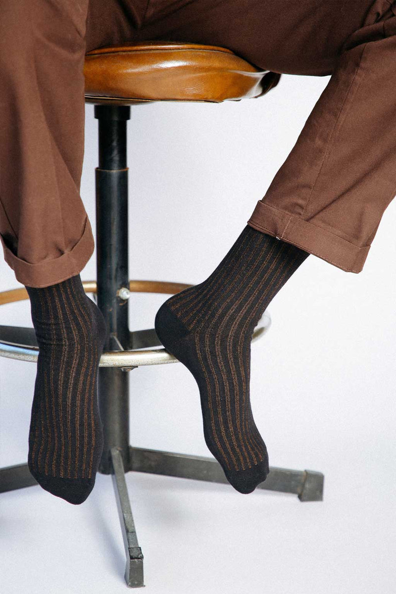 Close up photo of man’s feet wearing Tailored Union dress socks