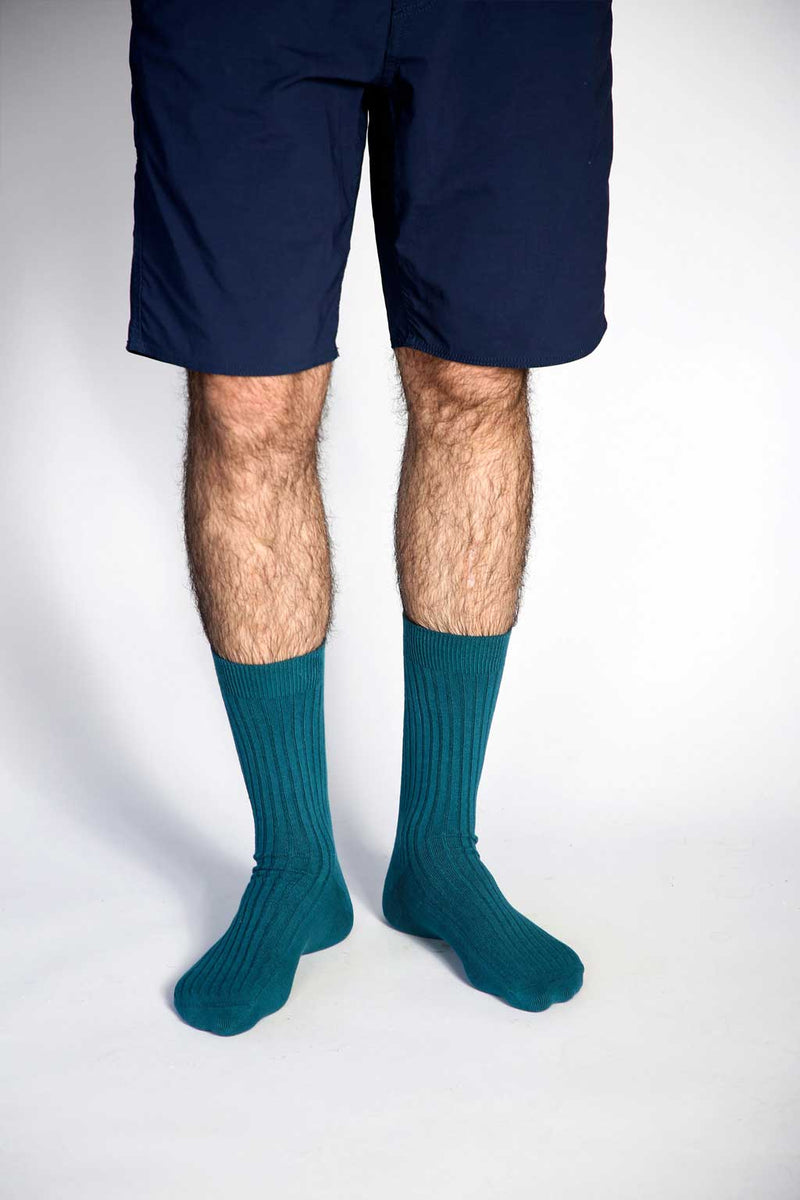 Close up photo of man’s feet wearing Tailored Union dress socks