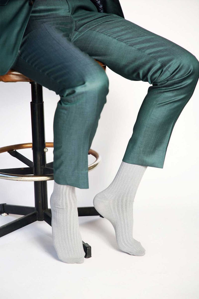 Close up photo of man’s feet wearing Tailored Union dress socks