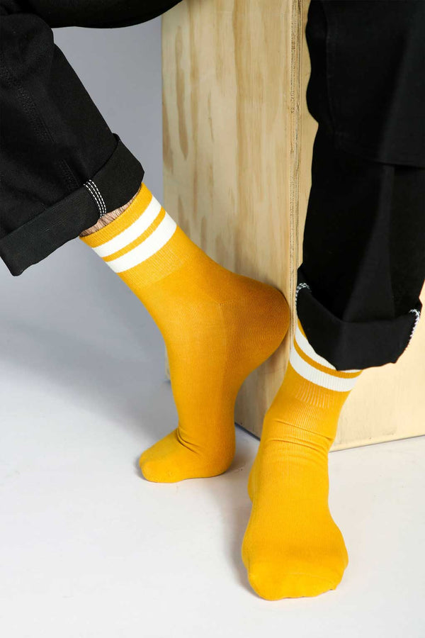 Close up shot of Tailored Union yellow and white tube socks