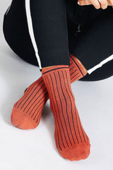 Close up photo of woman's feet wearing Tailored Union striped ankle socks
