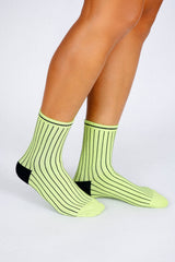 Photo of woman's feet wearing Tailored Union striped ankle socks