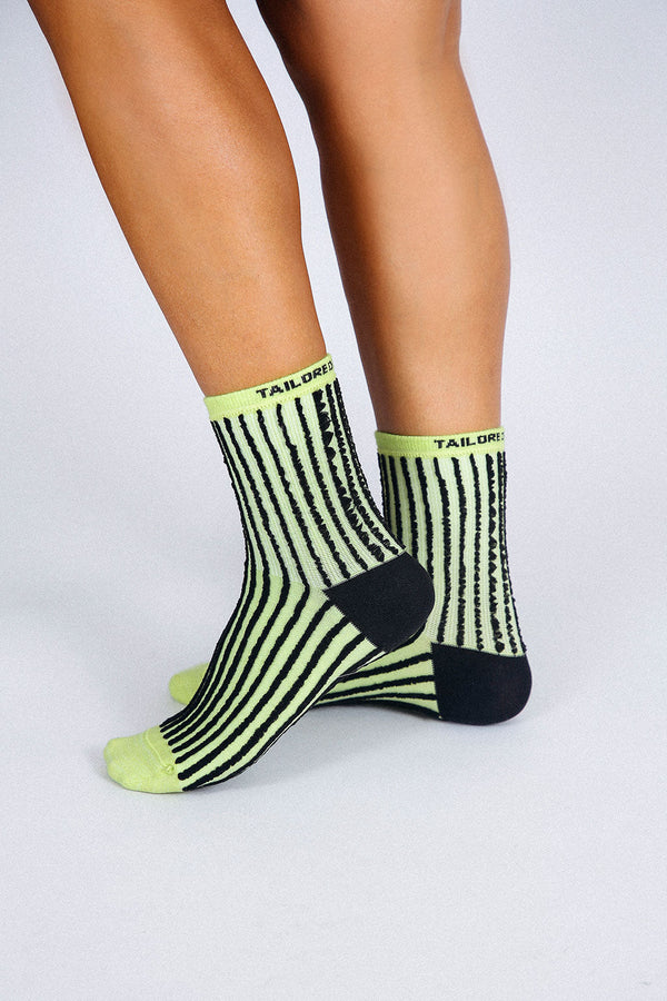 Photo of woman's feet wearing Tailored Union striped ankle socks