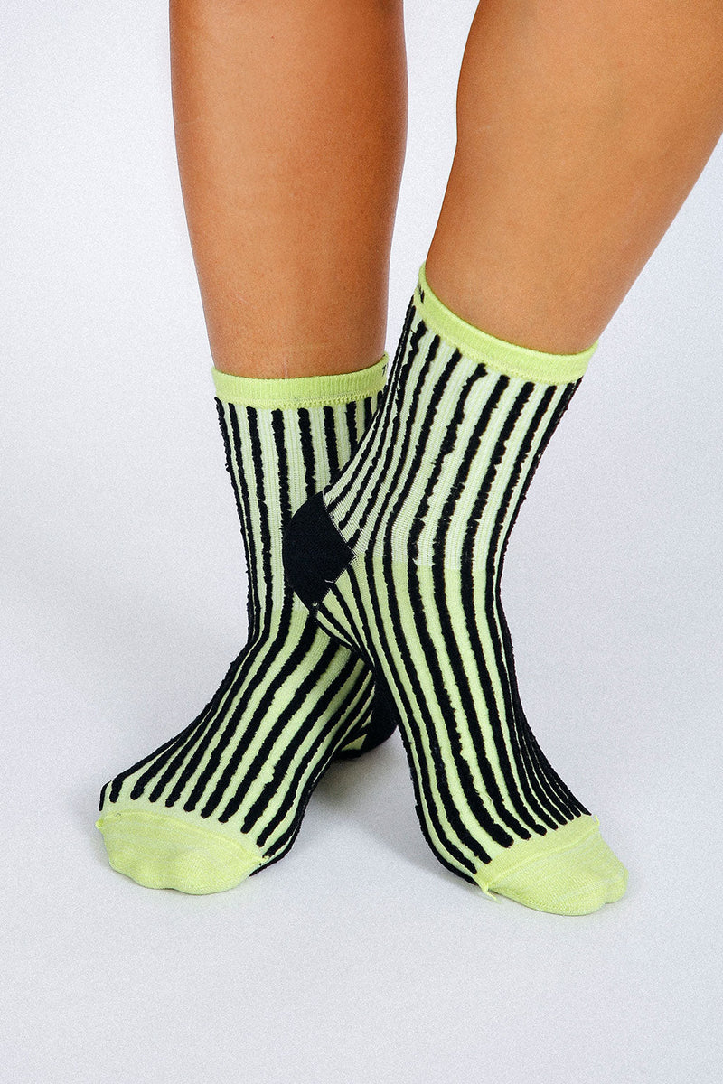 Photo of woman's feet wearing Tailored Union striped ankle socks