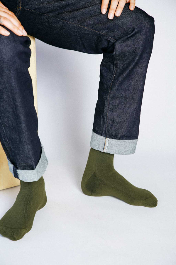 Man wearing Tailored Union olive green crew socks